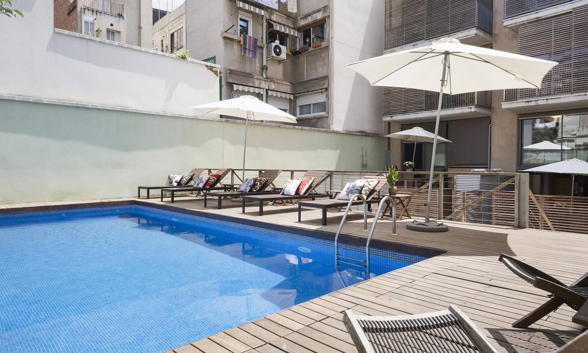 la Vila de Gracia Apartment | My Space Barcelona Apart. in a building with a shared swimming pool in Gracia