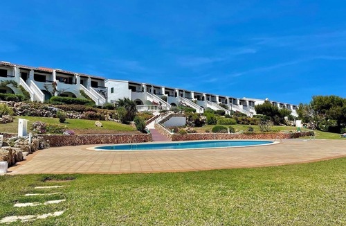 Arenal d'en Castell Apartment | 2 bedroom Apartment With Pool, Shared Gardens And Sea Views