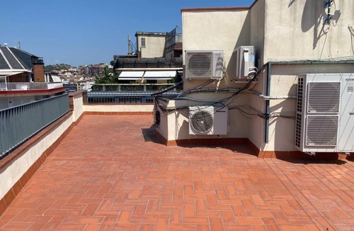Sant Gervasi – la Bonanova Apartment | Large double bedroom with desk, double bed, large wardrobe and window.