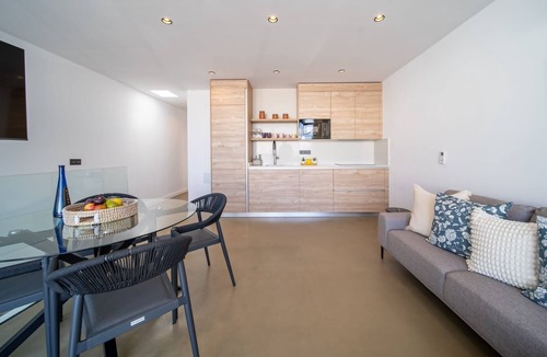 Caleta de Famara Apartment | Vacation 'Kay Lava' with Mountain View, Wi-Fi and Air Conditioning