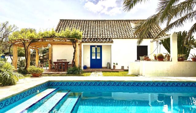 Traditional Spanish house with private pool near the beach.