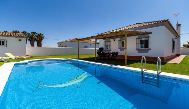 Holiday Home "Chalet Isla del Sotillo" a Short Drive from Beach with Pool & Large Garden