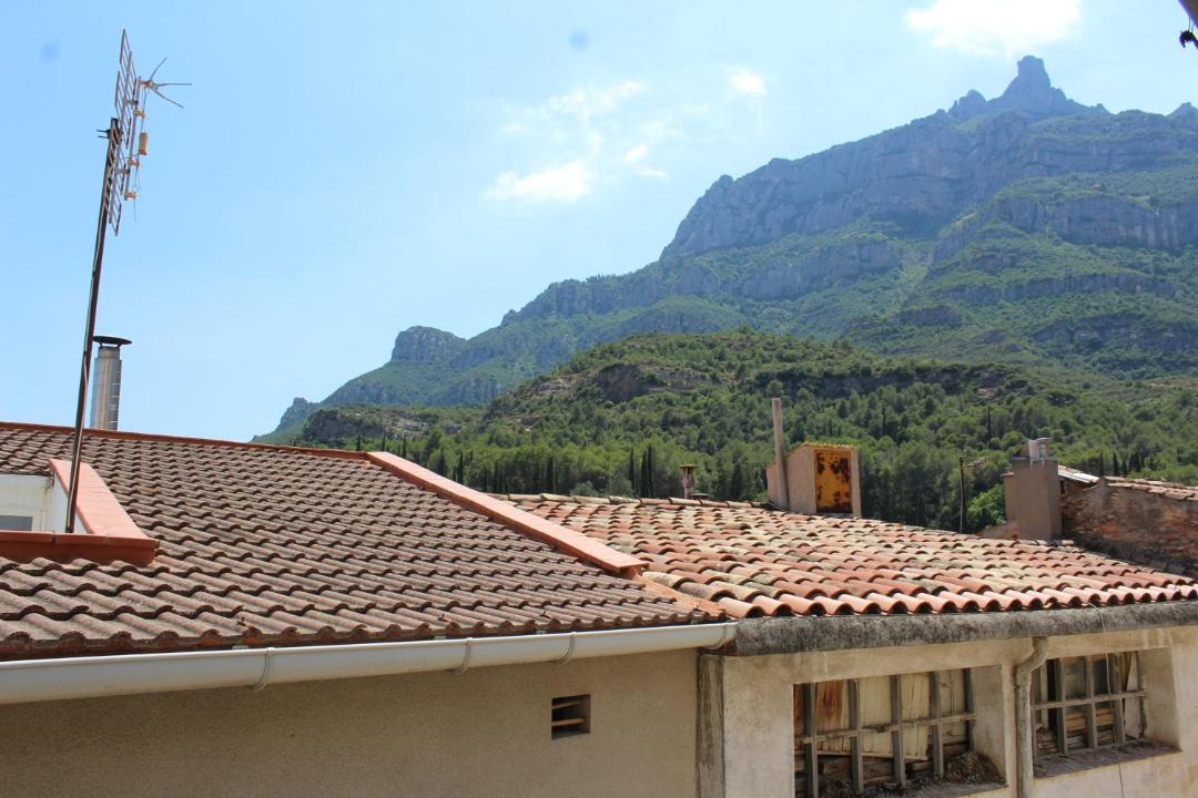 Monistrol de Montserrat Apartment | 3-Story Gaudi Building with Montserrat Stone