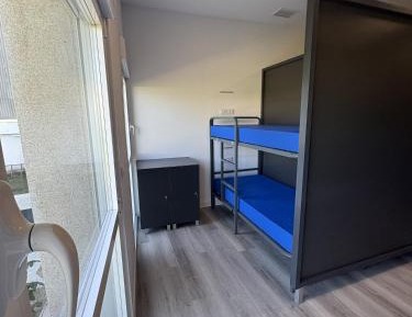 Single Bed in Dormitory Room
